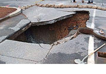 Don't ignore sinkholes--they can grow and endanger structures on your and your neighbors' property.
