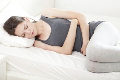 Éprouvez-vous des symptômes de la grossesse tels que nausées?